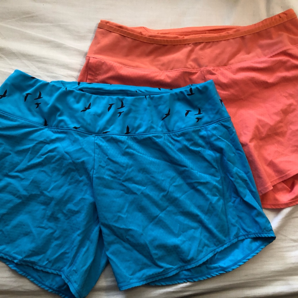 Two pairs size 10 Oiselle Long Roga Shorts. Aqua blue and peach.
